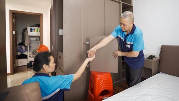 Mr. and Mrs. Huang working together
