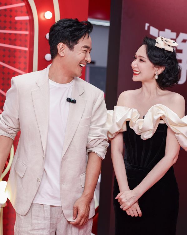 Celebrity couple interacting